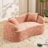 Pink curved two - person compress sofa. It has armrests on both sides, comes with two pillows, is suitable for small - sized apartments