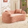 Pink curved two - person compress sofa. It has armrests on both sides, comes with two pillows, is suitable for small - sized apartments