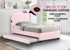 PINK TWIN SIZE UPHOLSTERED BED FRAME WITH TRUNDLE BED, TEDDY FABRIC, USB FUNCTIONALITY, AND A POCKET DESIGN ON THE SIDE OF THE HEADBOARD FOR STORING S